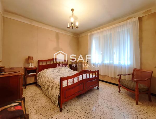 Maison familiale avec immense rez-de-chaussé exploitable