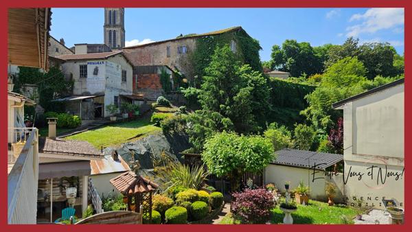 Propriété 3 logements avec terrain et garages