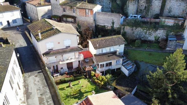 Propriété 3 logements avec terrain et garages