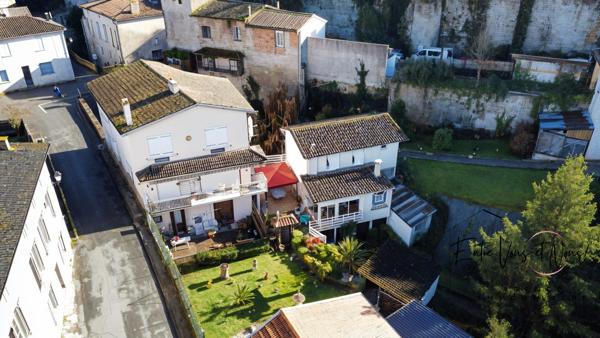 Propriété 3 logements avec terrain et garages