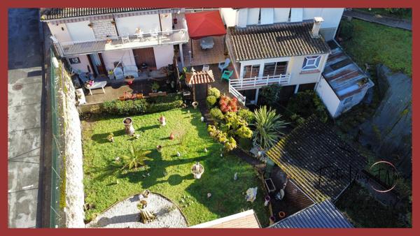 Propriété 3 logements avec terrain et garages