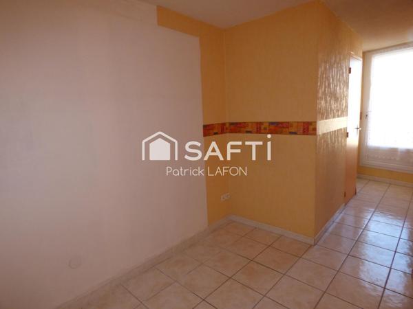 MAISON AVEC GARAGE AU CENTRE