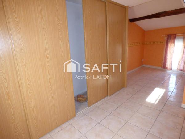 MAISON AVEC GARAGE AU CENTRE