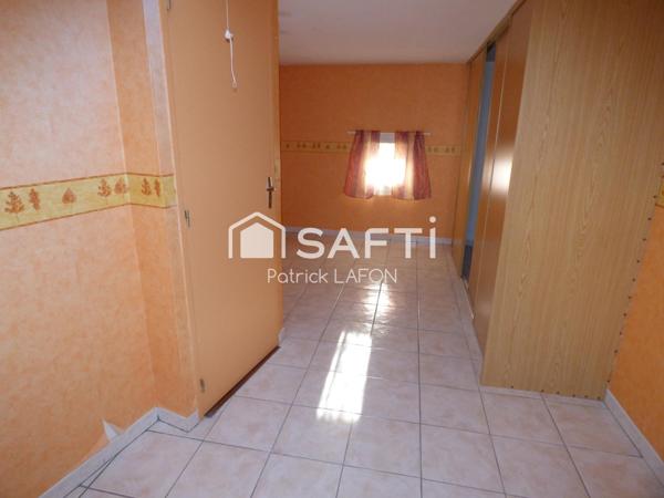 MAISON AVEC GARAGE AU CENTRE