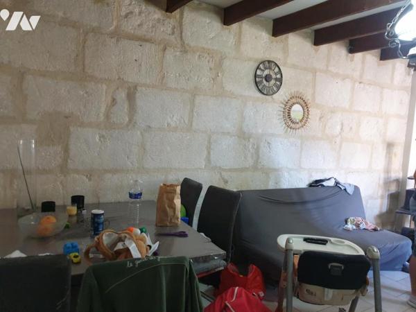 Immeuble de rapport composé de 5 logements avec deux garages et une remise