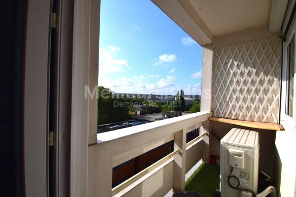 Appartement 3 chambres avec balcon, cave et stationnement