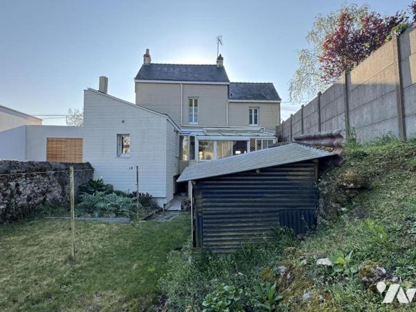 Maison à fort potentiel avec jardin et garage en centre-ville de Savenay