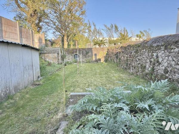 Maison à fort potentiel avec jardin et garage en centre-ville de Savenay