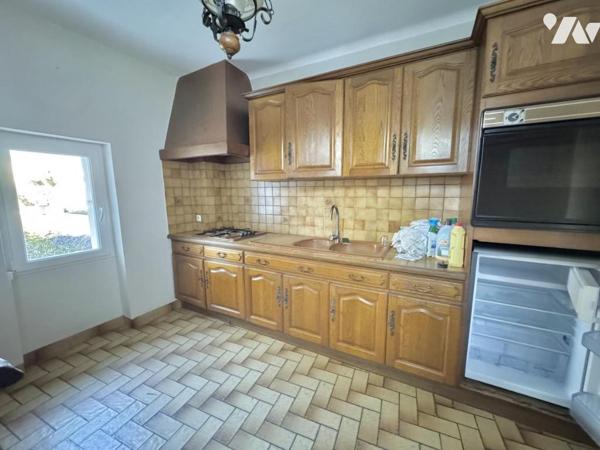 Maison à fort potentiel avec jardin et garage en centre-ville de Savenay