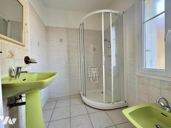 Maison à fort potentiel avec jardin et garage en centre-ville de Savenay