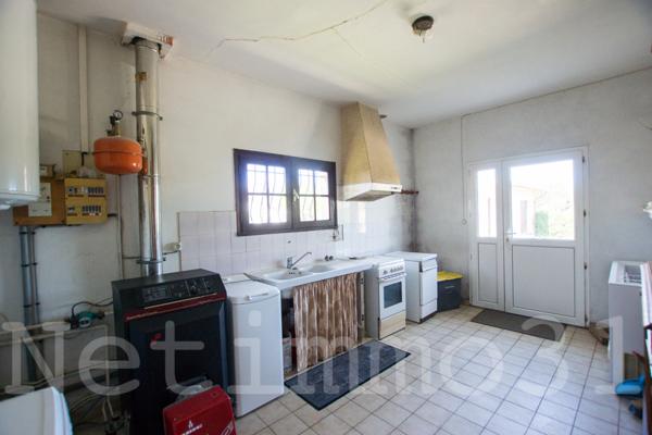 Maison avec garage et jardin