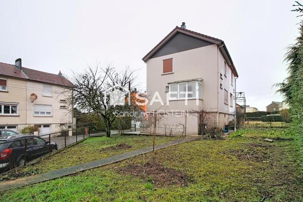 Maison jumelée avec jardin et garage