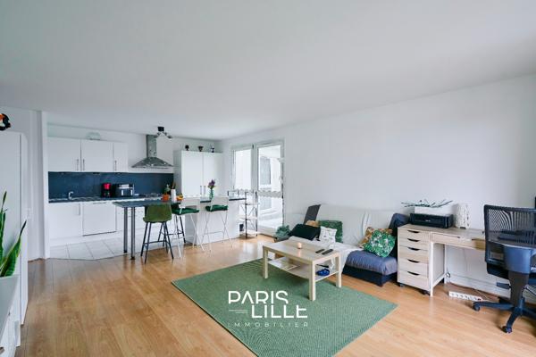 T2 proche centre et gare, balcon et parking.