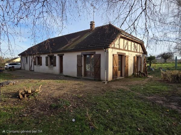 Maison de plain pied, trois chambres avec terrain et garage.