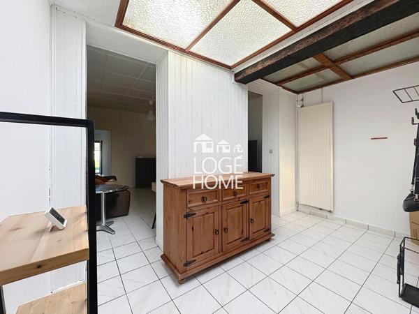 Coquette maison de village en semi plain pied offrant 2 chambres jardin garage