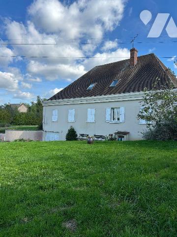 Une maison d'habitation élevée sur sous-sol total comprenant: 
Au rez-de-chaussée: vestibule, ...