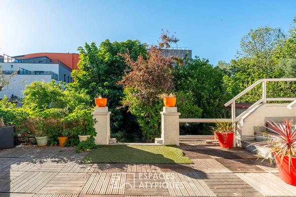 Maison divisée en duplex avec jardin