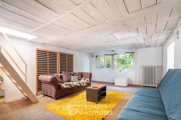 Maison divisée en duplex avec jardin