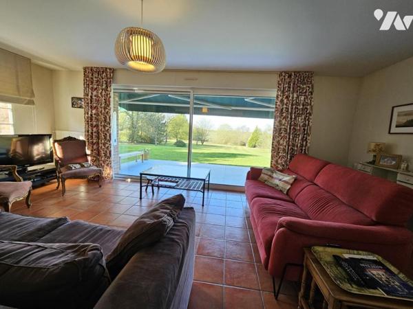 Pavillon individuel sur 8412 m² de terrain arboré