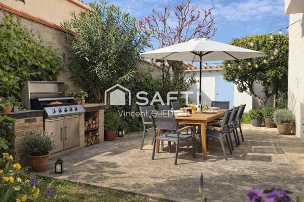 Maison 3 faces avec jardin et cabanon