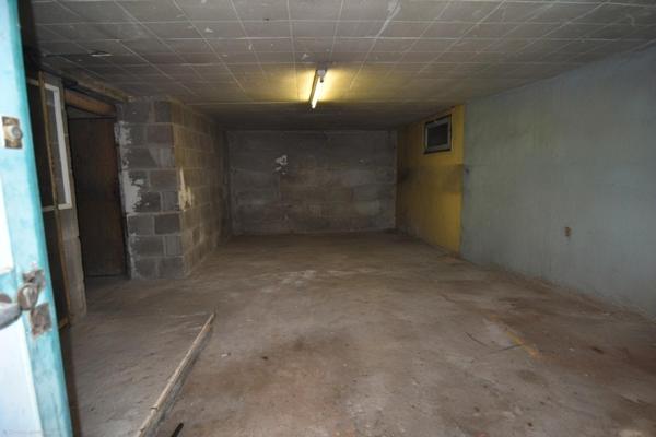 Maison avec garage XXL et fort potentiel