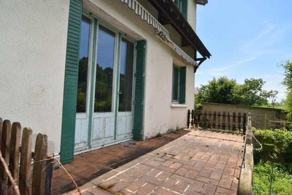 Maison avec garage XXL et fort potentiel
