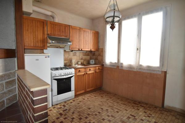 Maison avec garage XXL et fort potentiel