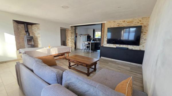 Maison familiale avec grand terrain et potentiel constructible