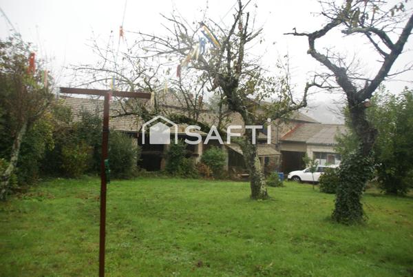 Grande maison avec joli terrain constructible