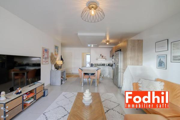 Appartement familial 4 pièces 87 m² avec 3 chambres, 2 balcons et 2 parkings.