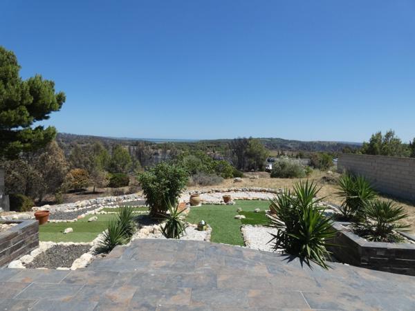 Villa plain pied 4 faces de 134m² sur terrain paysagé de 1470m²