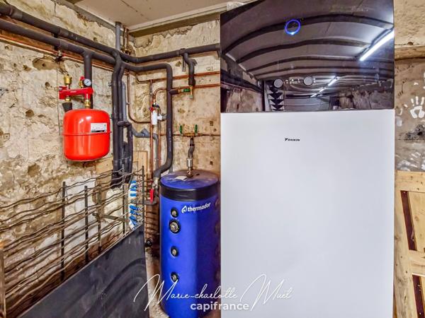 Grande maison de ville avec terrasse de 70 m² et garage, rénovée avec cachet et authenticité