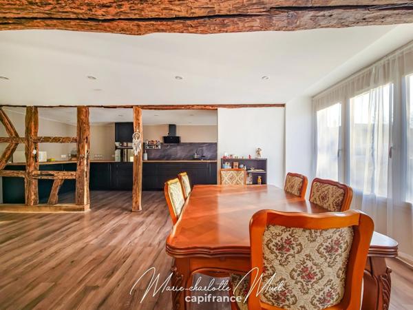 Grande maison de ville avec terrasse de 70 m² et garage, rénovée avec cachet et authenticité