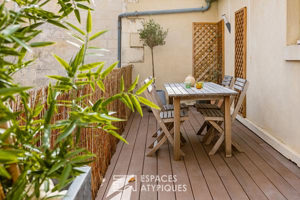 Appartement avec terrasse et finitions soignées proche du marché