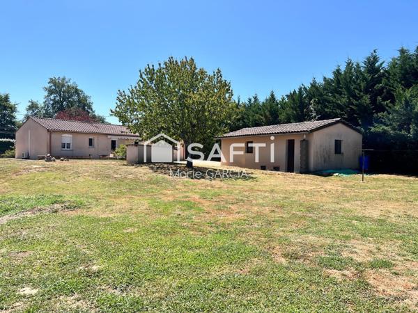 Maison de plain-pied 103 m² – 4 chambres – Terrain 2 000 m² – Garages & ateliers