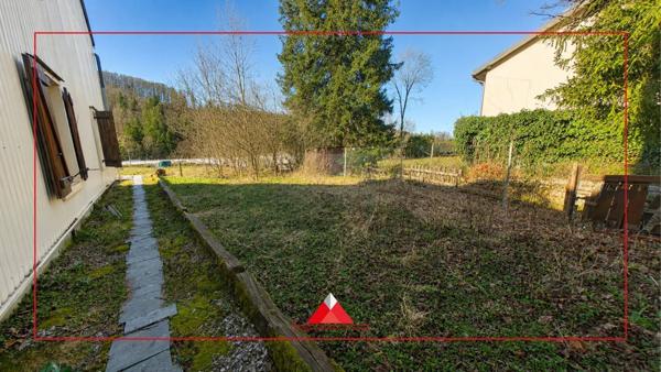 Maison mitoyenne avec terrain et garage