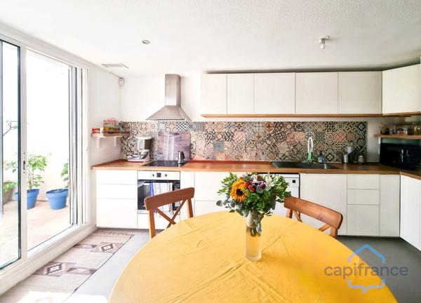 Appartement rénové de 76m² avec terrasse et place de parking