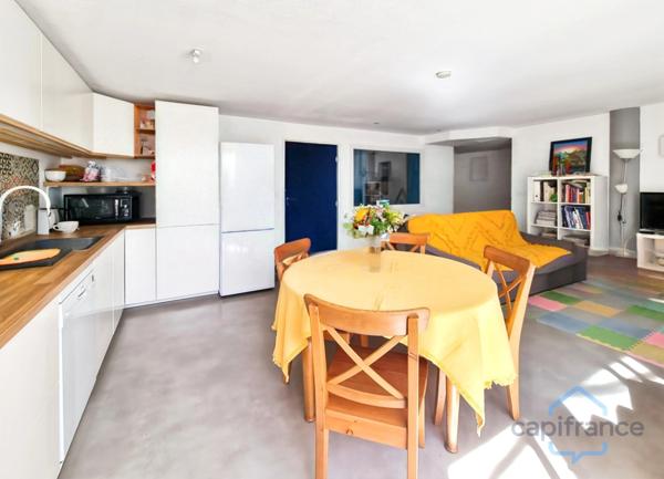 Appartement rénové de 76m² avec terrasse et place de parking