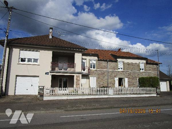 Maison en bon état d'entretien composée composée de 2 appartements avec terrain  attenant de 58 ares