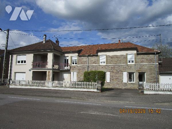 Maison en bon état d'entretien composée composée de 2 appartements avec terrain  attenant de 58 ares