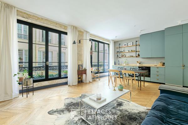 Appartement esprit atelier sur cour pavée au coeur du 10ème.