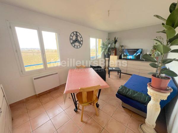 Ensemble immobilier: 1 appartement + 1 local commercial de 190 m² + 1 local de 55 m²