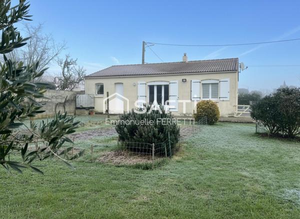 Maison de plain-pied au cœur du village – Calme, jardin et potentiel