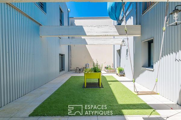 Ancien entrepôt rénové avec piscine, garage et terrasses proche des Quais