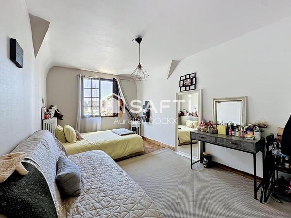 Spacieuse maison avec garage et agréable jardin