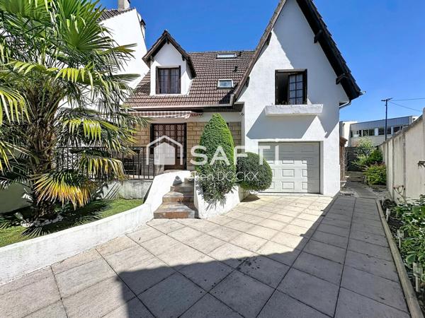 Spacieuse maison avec garage et agréable jardin
