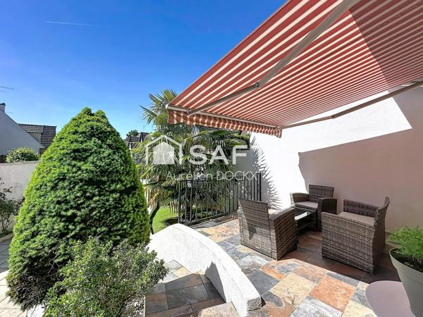 Spacieuse maison avec garage et agréable jardin