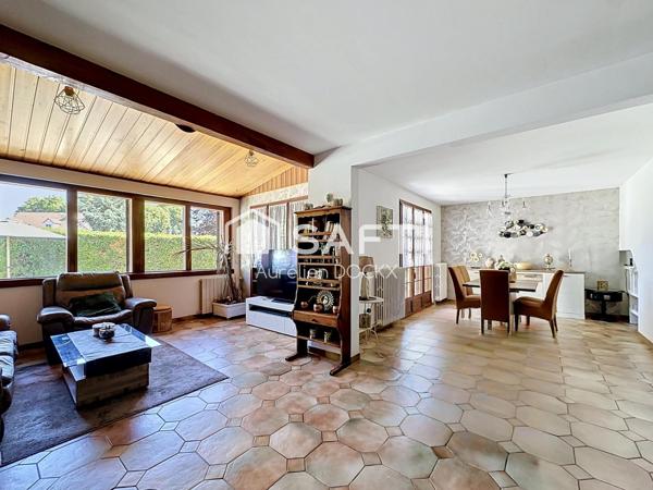 Spacieuse maison avec garage et agréable jardin