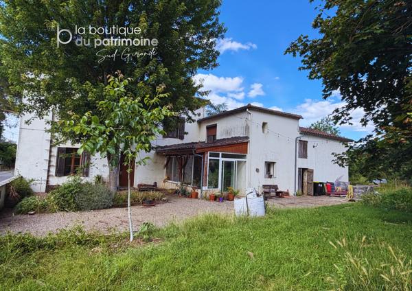 Maison en pierre avec terrain constructible et dépendances