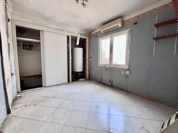 Maison de plain-pied de 95 m² environs avec travaux à prévoir sur un terrain de 509 m² proche de l'aéroport